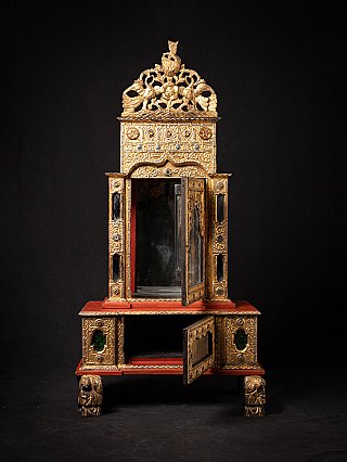 Wooden Burmese temple shrine with open glass door and open lower compartment, front view