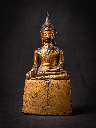 Thai wooden Buddha statue seated in bhumisparsha mudra, full front view