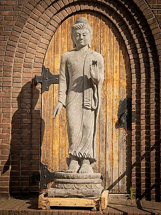 Lavastone Buddha statue from Indonesia, full front view on lotus base