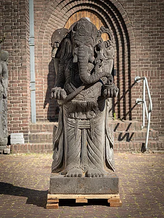 Lavastone Ganesha statue from Indonesia, standing on plinth, full front view
