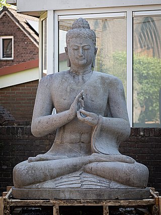 Indonesian lavastone Buddha statue seated with dharmachakra mudra, full front view