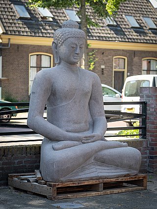 Buddha statue in Indonesian lava stone, seated, three-quarter left view