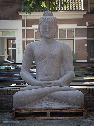 Buddha statue of Indonesian lava stone, seated in dhyana mudra, full front view