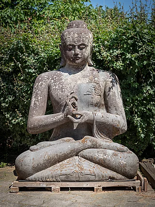 Large Indonesian lavastone Buddha statue seated in dharmachakra mudra, full-front view