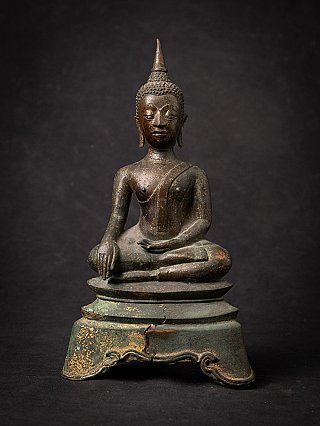 Antique Thai bronze Buddha statue seated in bhumisparsha mudra, full front view