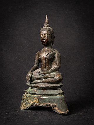 Thai bronze Buddha statue on tall base, three-quarter left view