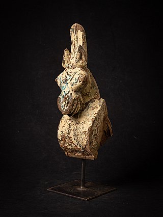Antique Indian wooden temple fragment of a horse head, three-quarter view on metal stand