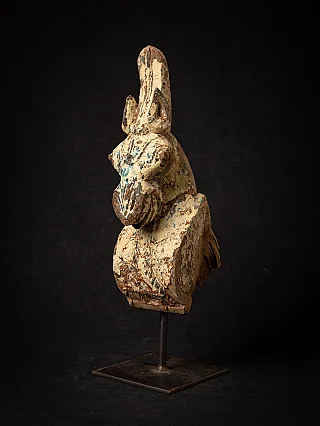 Antique Indian wooden temple fragment of a horse head, three-quarter view on metal stand