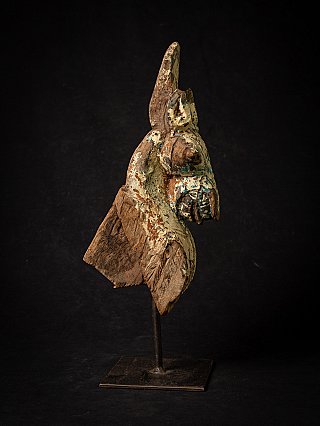 Horse head wooden temple fragment from India, three-quarter view with flaking paint