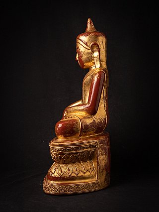 Burmese wooden Buddha statue seated, left side profile view