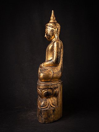 Burmese Shan Buddha statue in wood, seated posture, left side profile