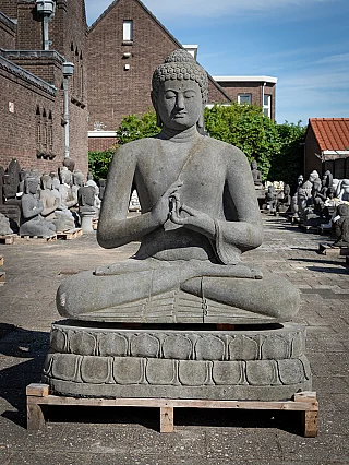 Buddha statue in Indonesian lavastone, seated on lotus throne, full front view with Dharmachakra mudra