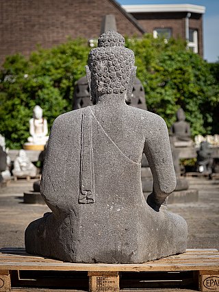 Lavastone Buddha statue, rear view with carved curls and robe line on the back