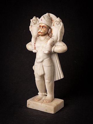 Hanuman statue carved in Indian marble, three-quarter view showing the draped cloth and base