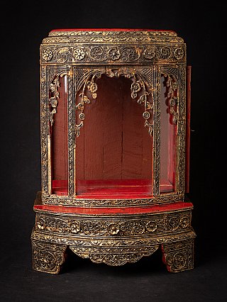 Antique wooden Burmese Buddha shrine, front view with red interior and gilt decoration