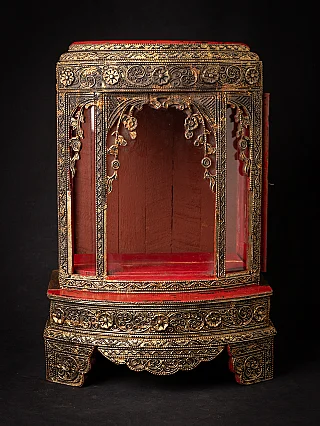 Antique wooden Burmese Buddha shrine, front view with red interior and gilt decoration