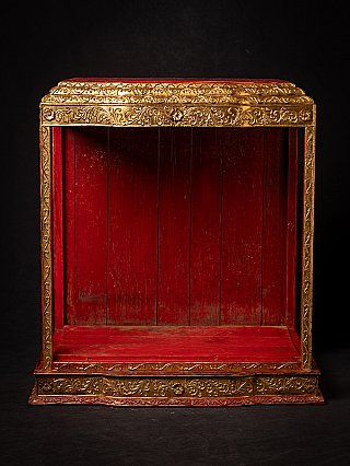 Antique wooden Burmese temple shrine, front view with red interior and gilt decoration