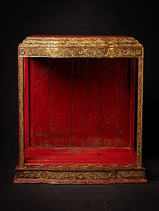 Antique wooden Burmese temple shrine, front view with red interior and gilt decoration