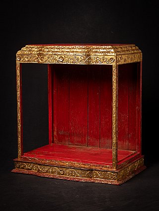 Antique wooden Burmese temple shrine, three-quarter view showing gilt roof and open front