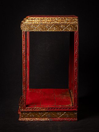 Wooden Burmese temple shrine, side view with narrow opening and gilt moulding
