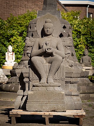 Buddha statue in Indonesian lavastone, seated with dharmachakra mudra, full front view