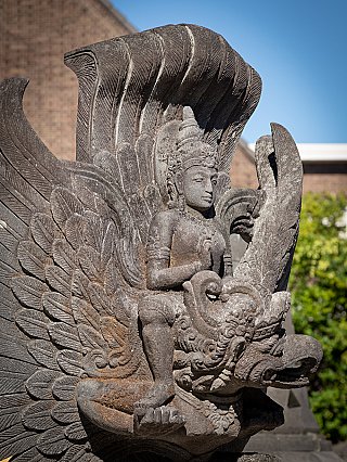 Detail of Vishnu seated on Garuda, showing crown, hand gesture and the bird head in lavastone