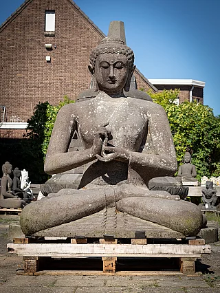 Large Indonesian lavastone Buddha statue seated in dharmachakra mudra, full front view