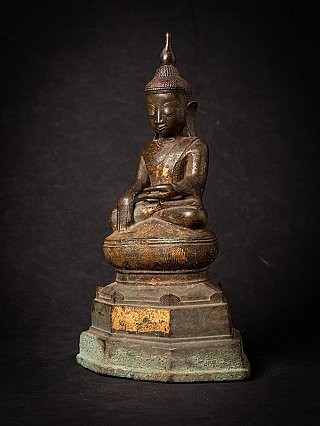 Bronze Burmese Buddha statue from Myanmar, three-quarter view with stepped base