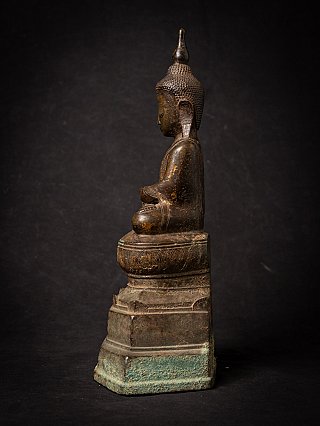 Seated Burmese bronze Buddha statue, side profile showing head and ushnisha