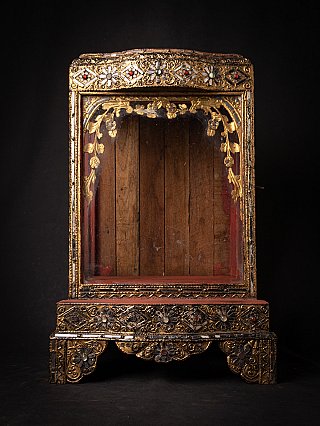 Antique Burmese wooden temple shrine with glass front, full front view