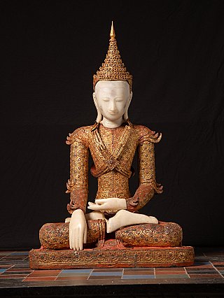 Burmese Buddha statue in wood, seated front view with ornate crown and gilt robe