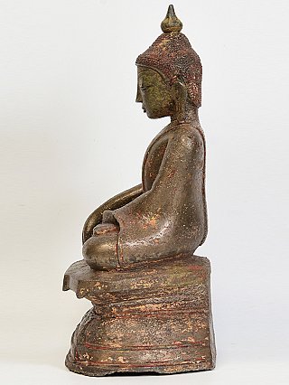 Burmese bronze Buddha statue seated, left side profile on stepped base