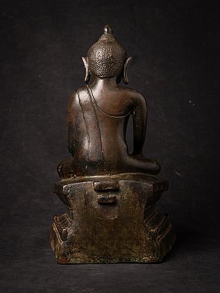Burmese bronze Buddha statue rear view, showing robe lines on the back and base