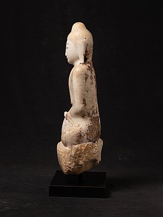 Burmese marble Buddha statue, left side profile showing stains on the back