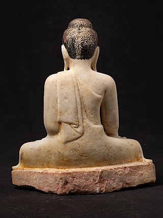 Marble Buddha statue from Myanmar, rear view with robe folds and rough base edge