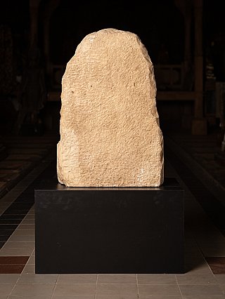Rear view of the marble stele of the Jain statue with rough-carved surface