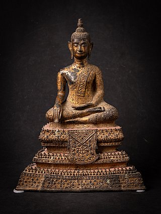 Thai bronze Buddha statue seated in bhumisparsha mudra, full front view on ornate base