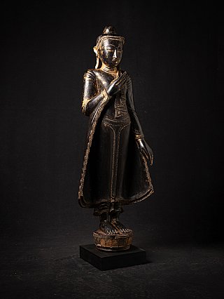 Wooden Buddha statue from Burma (Myanmar), three-quarter view with the base visible