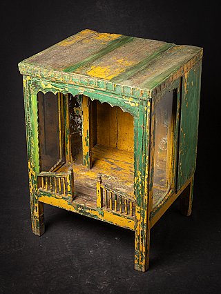 Antique wooden Indian temple shrine angled top view showing the roof boards and open interior