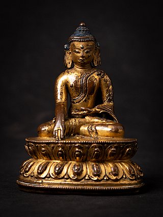 Gilt and lacquered Tibetan Shakyamuni Buddha statue seated, full front view on lotus base