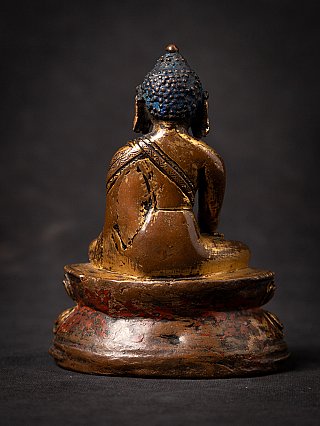 Gilt and lacquered Tibetan Shakyamuni Buddha statue, rear view with red lacquer on base