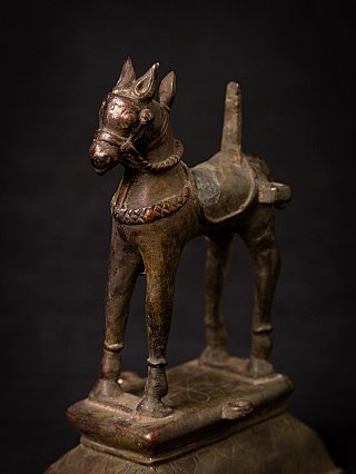 Antique Indian bronze horse statue on base, close-up three-quarter view