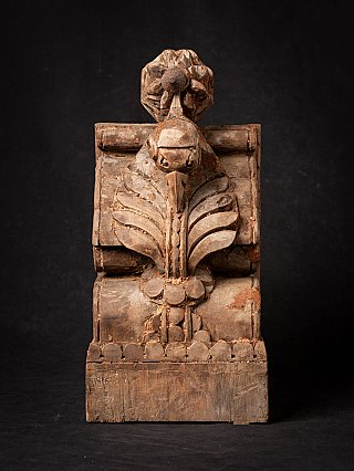 Antique Indian wooden temple fragment with central floral motif, full-front view