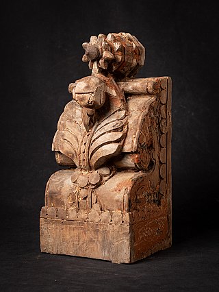 Antique Indian wooden temple fragment with floral carving, three-quarter left view
