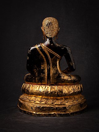 Thai bronze monk statue seated, rear view showing robe band