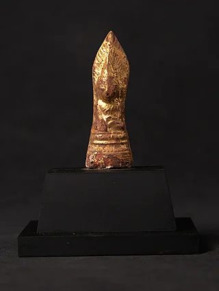 Burmese wooden Buddha statue amulet with gilded surface, full front view on black base