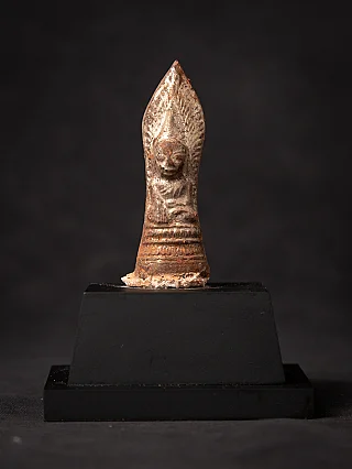 Buddha statue amulet from Burma (Myanmar) on black base, full front view with bhumisparsha mudra