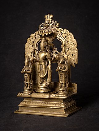 Bronze Indian Virabhadra plaque in three-quarter view showing the arched surround