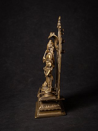 Antique Indian bronze Virabhadra plaque in side profile showing the depth and stepped base