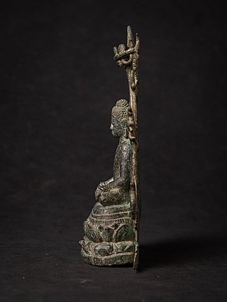 Pyu bronze Buddha statue, seated, narrow side profile showing the flat backplate